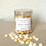 Caitlin Louise Collection's Coconut Mango handcrafted soy wax melt pebbles - white background, tan base.