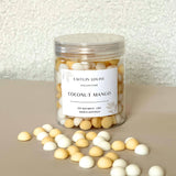 Caitlin Louise Collection's Coconut Mango handcrafted soy wax melt pebbles - white background, tan base.