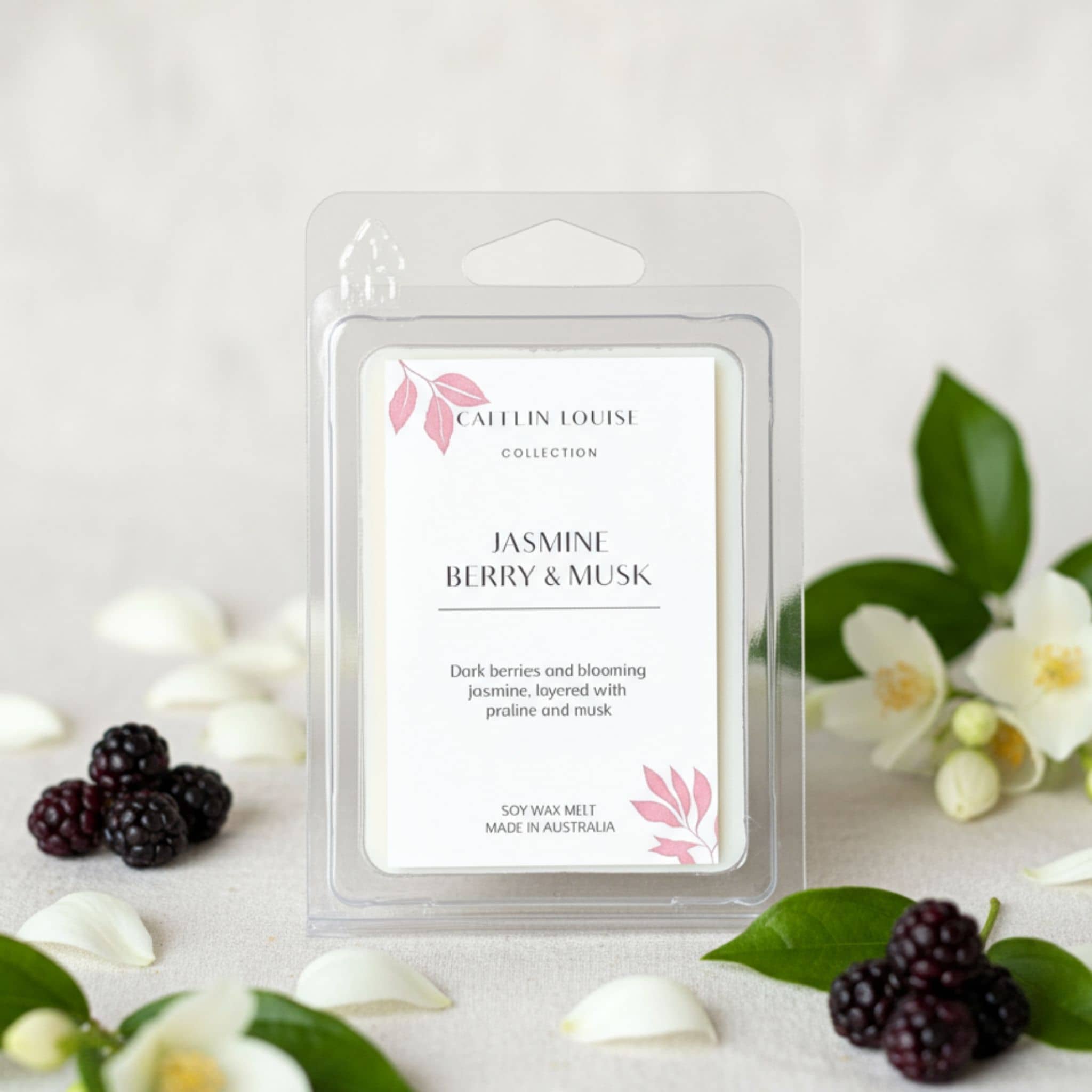 Caulin Louise Jasmine Berry & Musk wax melt packaging with berries and flowers on a light background