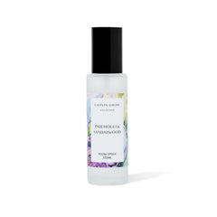 Patchouli and Sandalwood Room spray bottle with a label on a white background