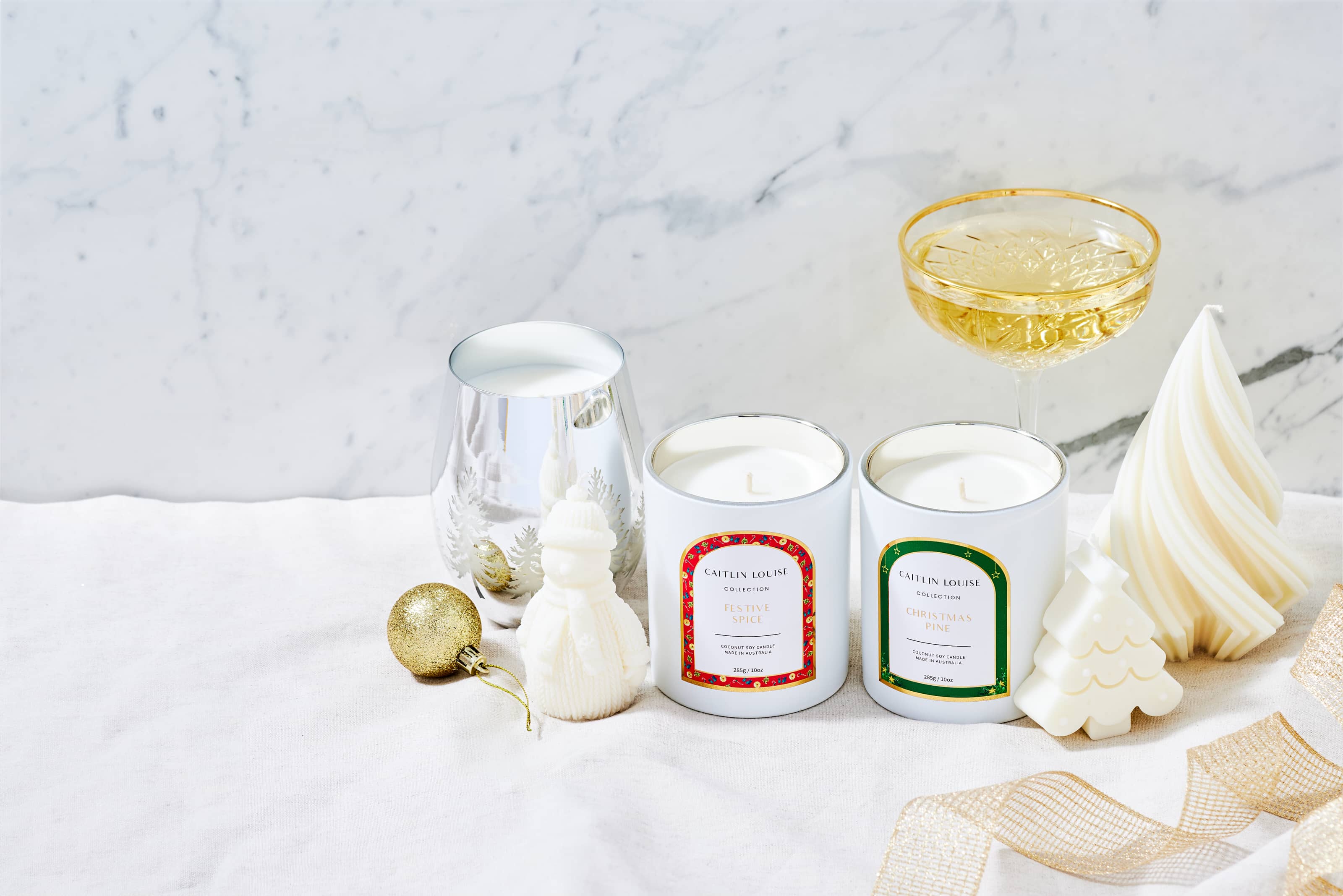 Caitlin Louise Collection Christmas scented and sculptural candles - marble background