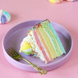 Rainbow birthday cake on a plate