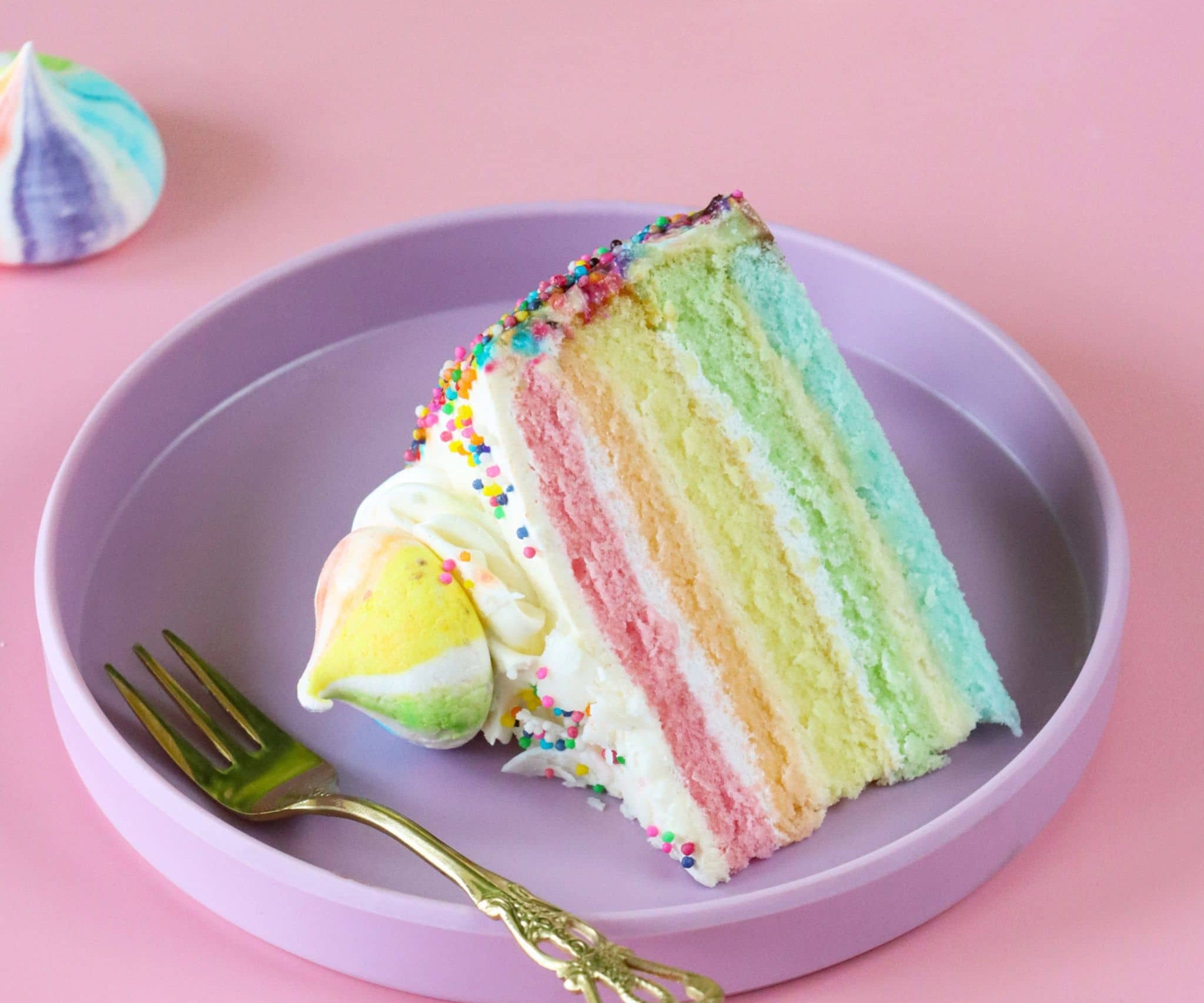 Rainbow birthday cake on a plate