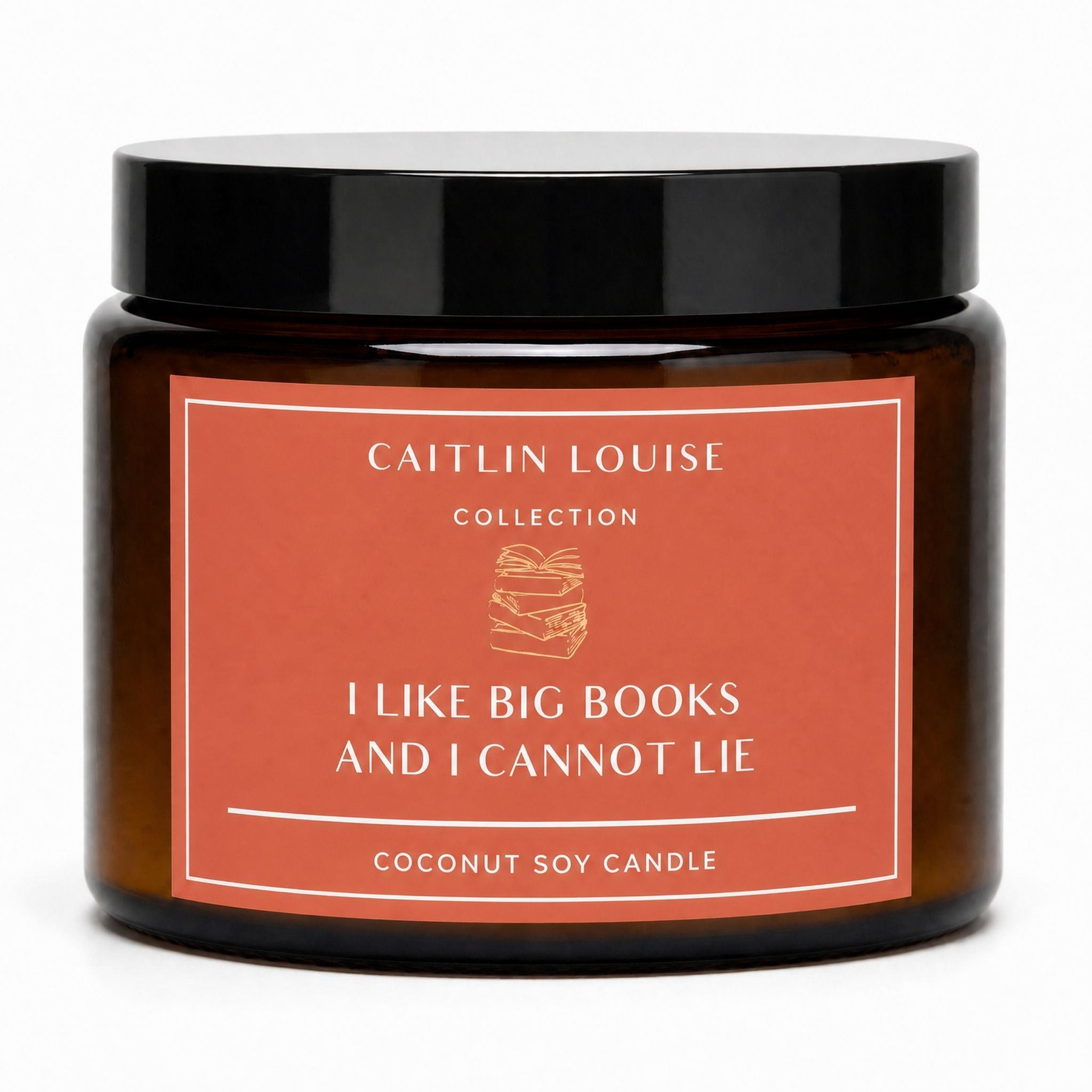 A coconut soy candle in an amber glass jar with a black lid and a terracotta-colored label. The label reads 'CAITLIN LOUISE COLLECTION' and 'I LIKE BIG BOOKS AND I CANNOT LIE'.
