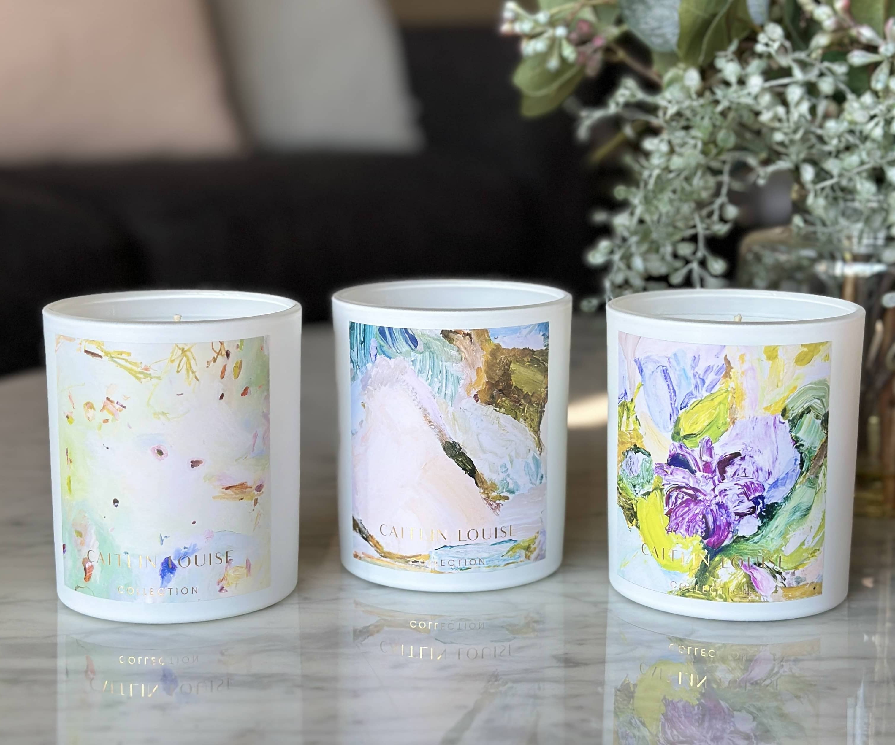 Annie Everingham and Caitlin Louise Collection Candle Collection - styled on coffee table