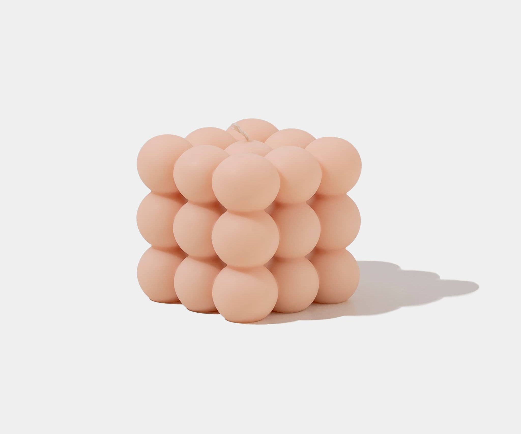 Caitlin Louise Collection apricot coloured bubble cube sculptural candle - white background