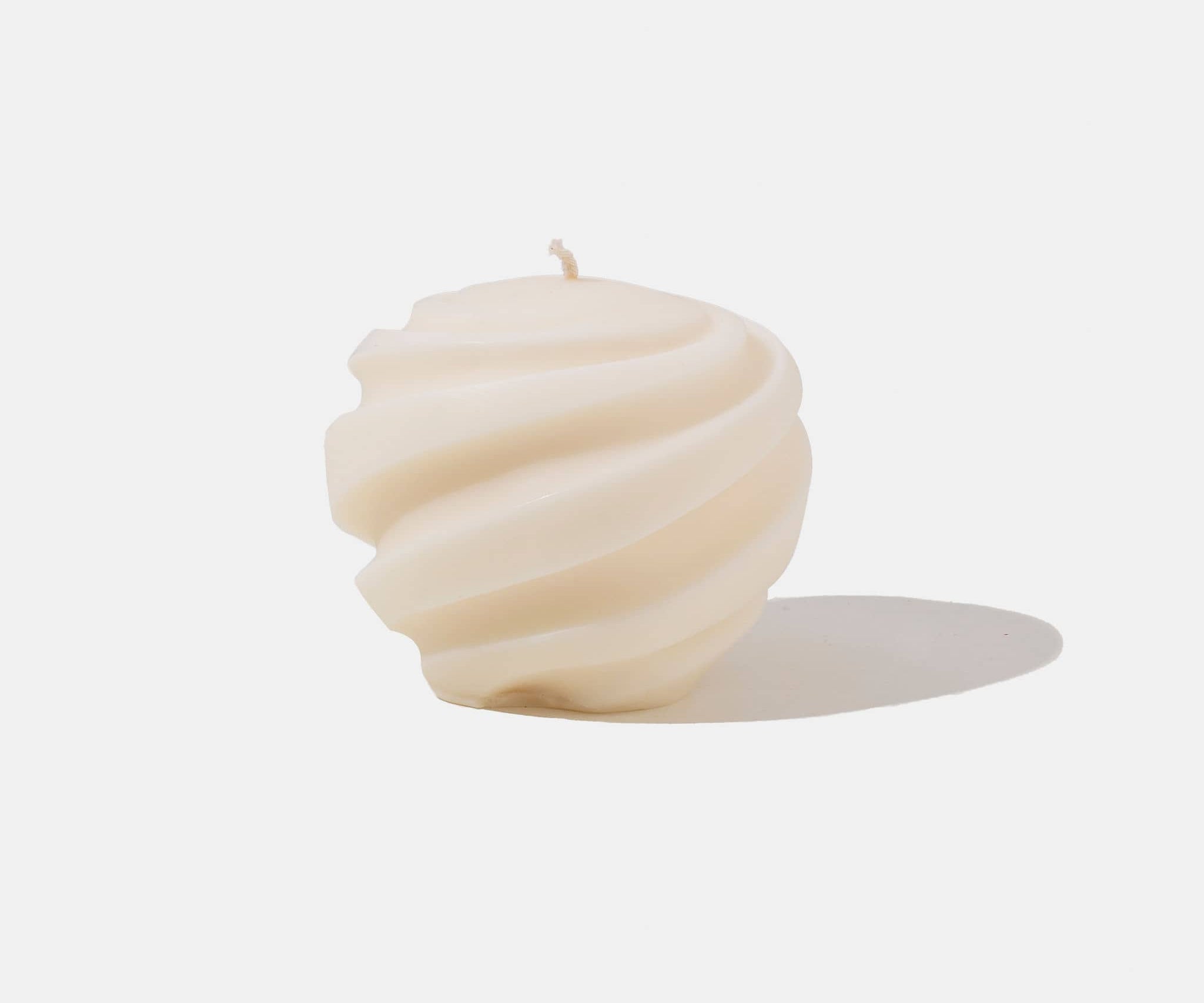 White spiral shaped candle - white background