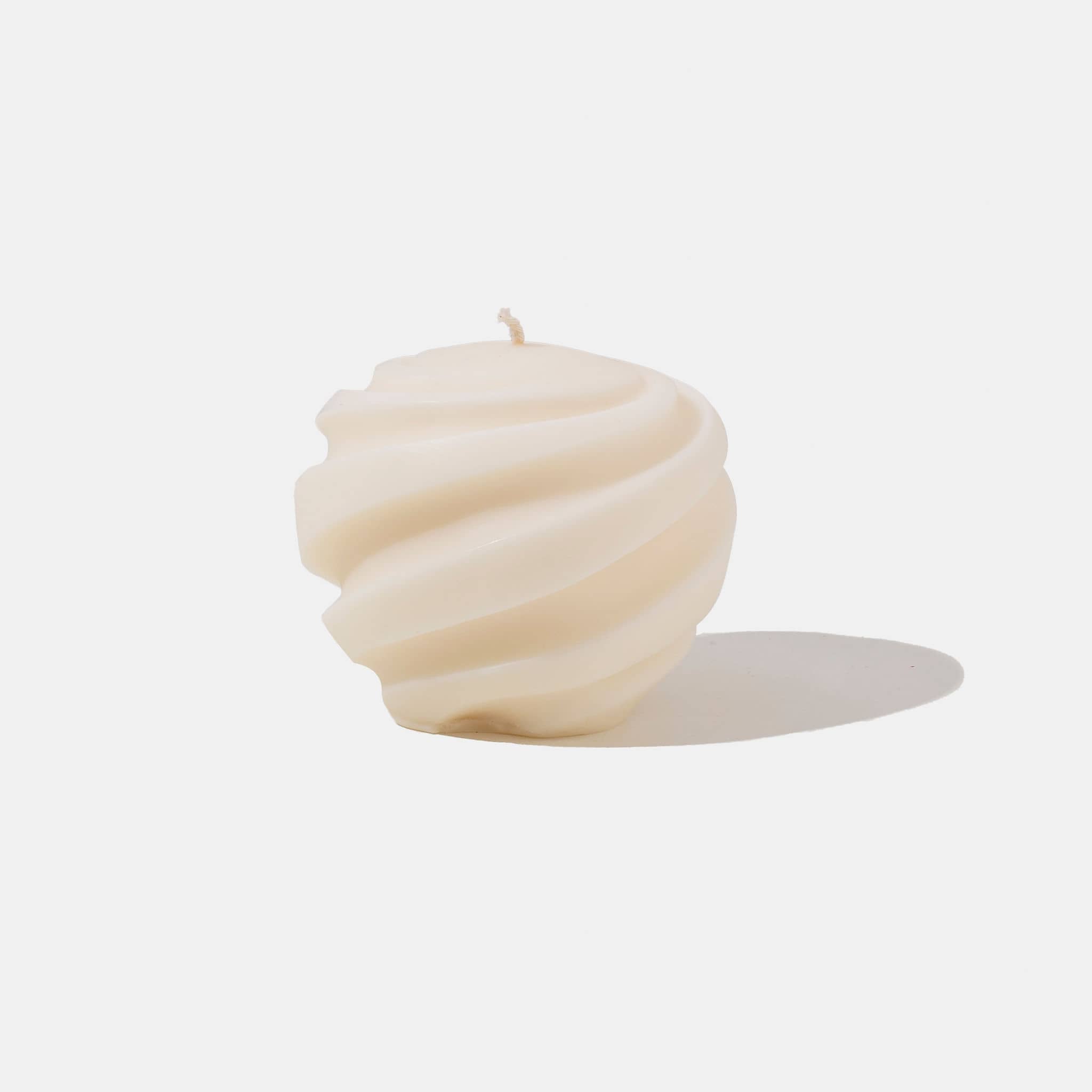 White spiral shaped candle - white background