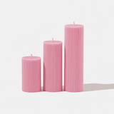 Dusty pink lumiere pillar candles in 3 sizes on white background