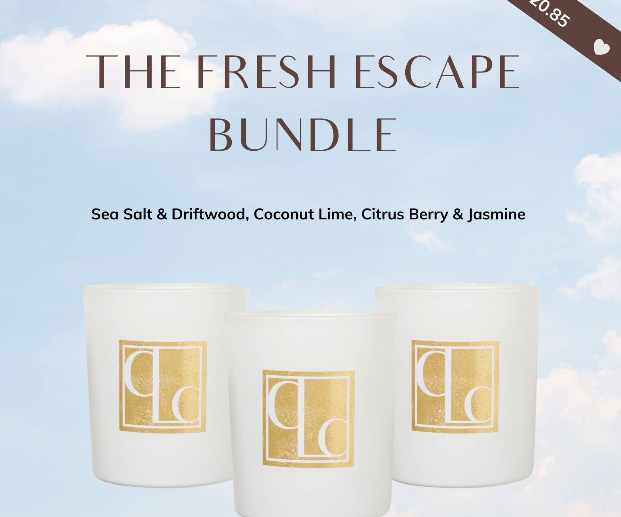 Three candles in white containers with gold logos on a light blue background with clouds.