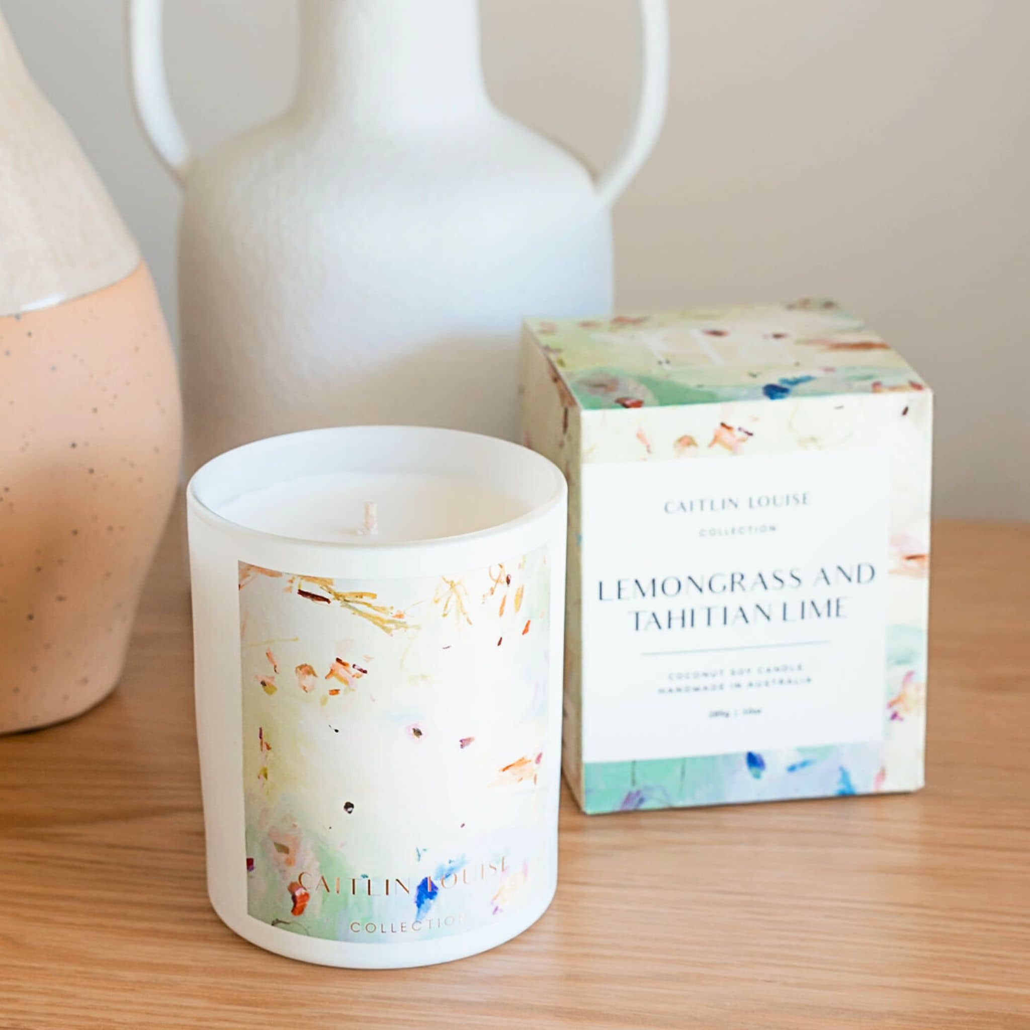 Caitlin Louise Collection Lemongrass and Tahitian Lime Annie Everingham Artist candle - styled on wooden bench