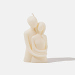 Lovers embrace candle - front view - white background