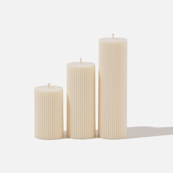 Wide column pillar candles - set of 3 on white background