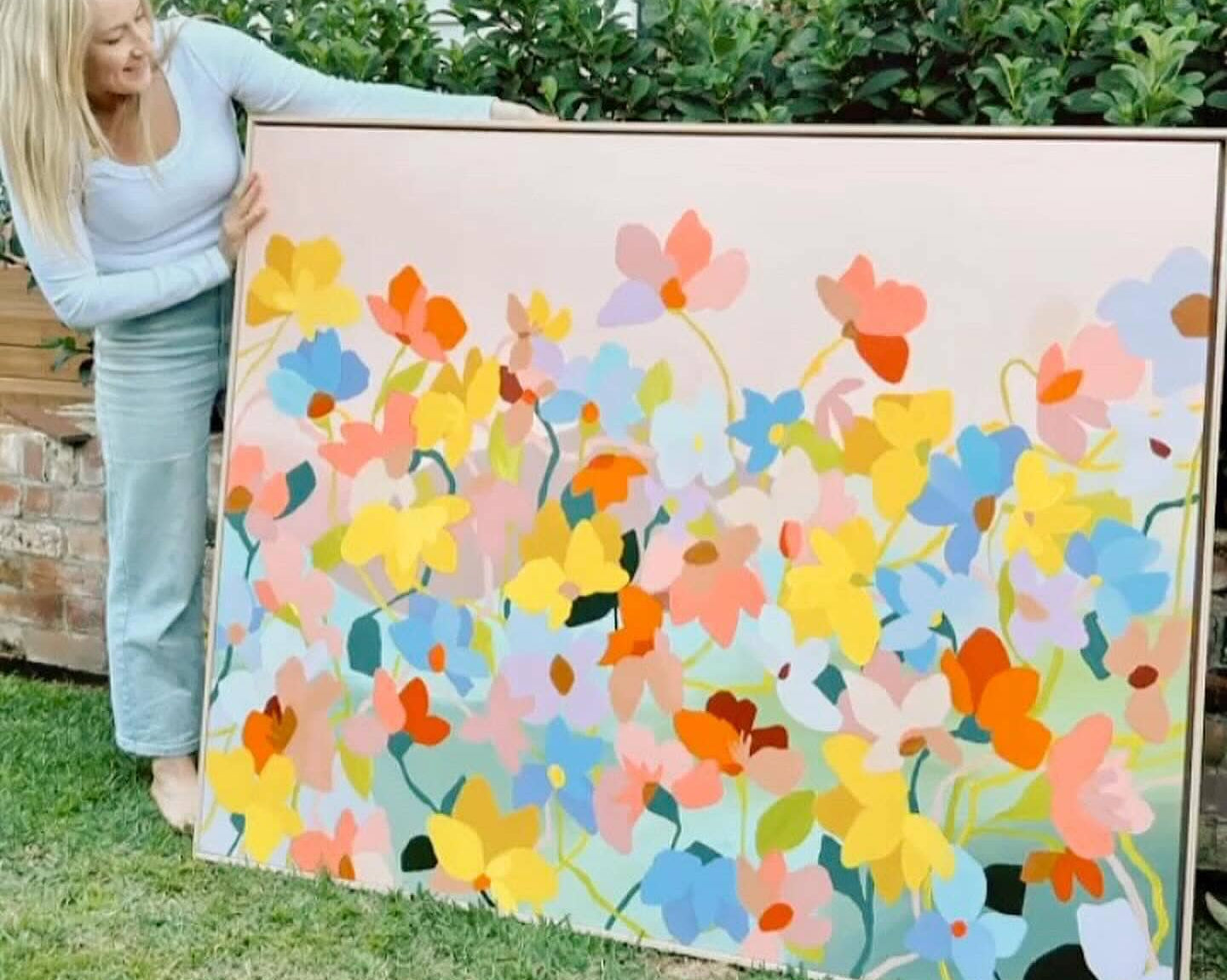 Prudence De Marchi showing her original artwork used on Camellia and Lotus candle label