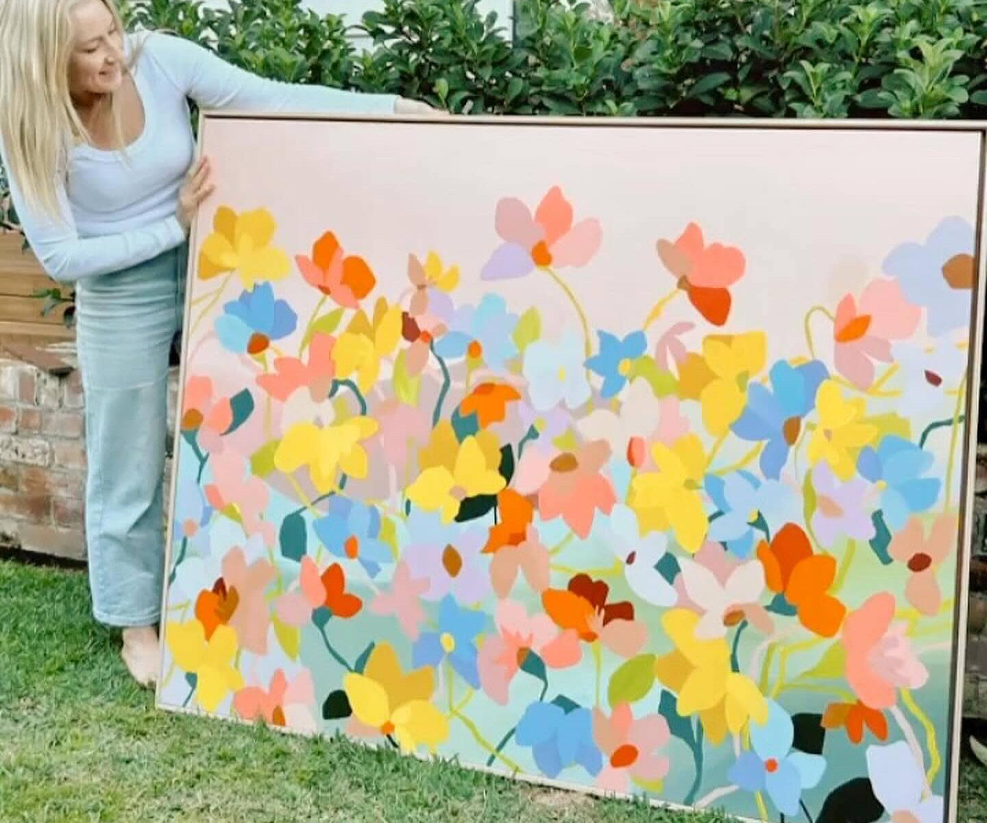 Prudence De Marchi showing her original artwork used on Camellia and Lotus candle label
