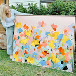 Prudence De Marchi showing her original artwork used on Camellia and Lotus candle label