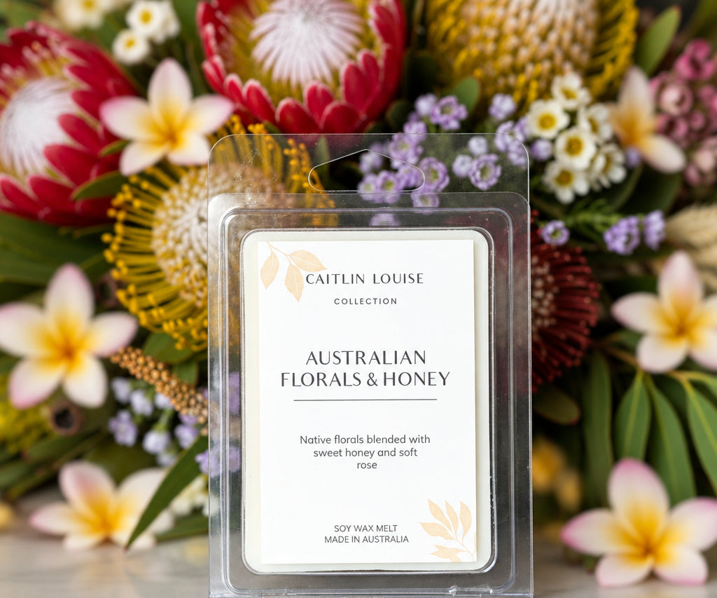 Native florals and honey wax melt with Australian native flowers in background