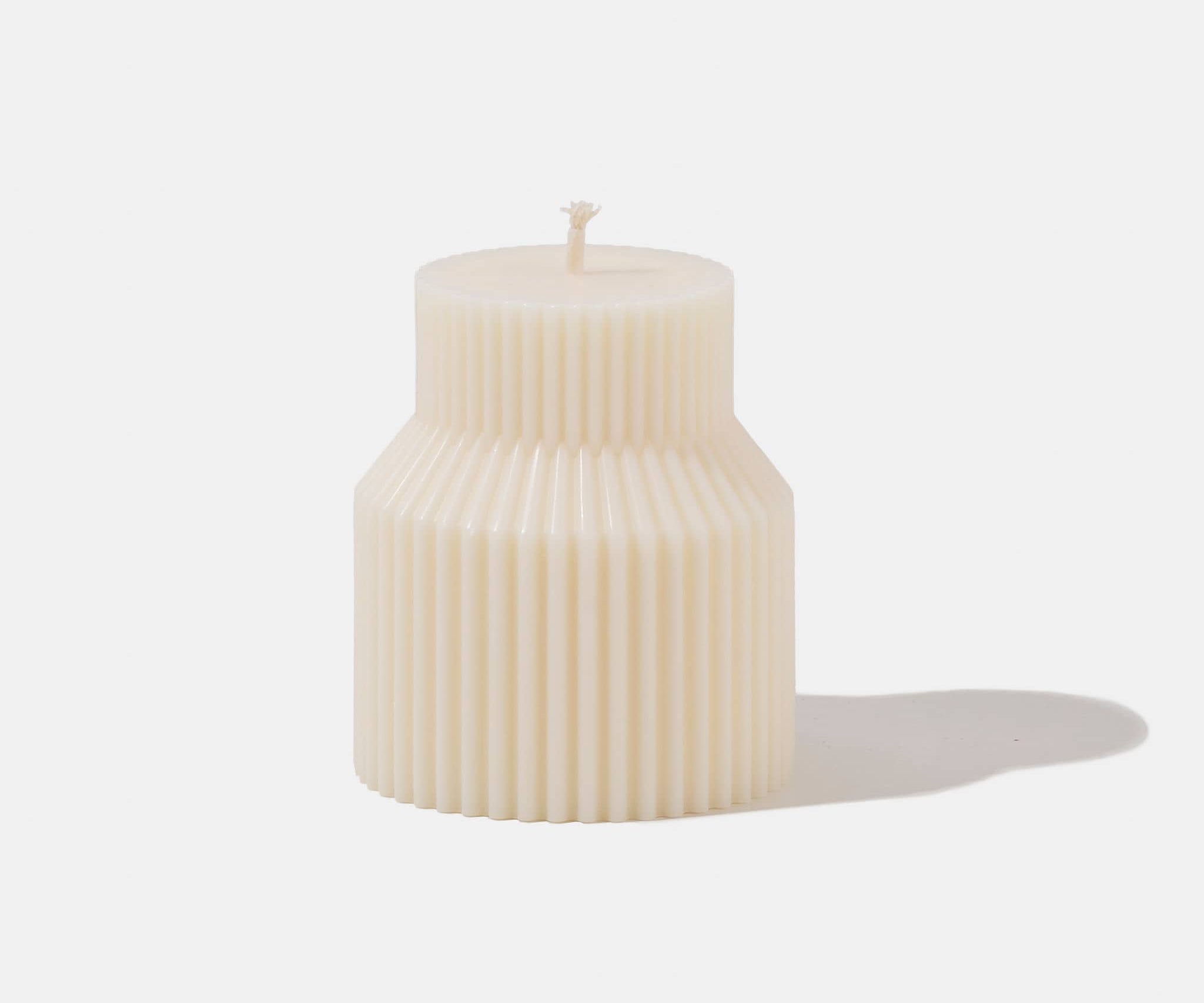 White stepped pillar candle - white background