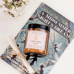 Caitlin Louise Collection A Midsummer Night Bookish Candle - styled on book with scroll and flowers - birds eye view