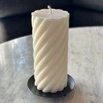 Caitlin Louise Collection black candle plate with pillar candle on top - shot from higher angle