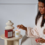 Model lighting Black Cherry Woods candle