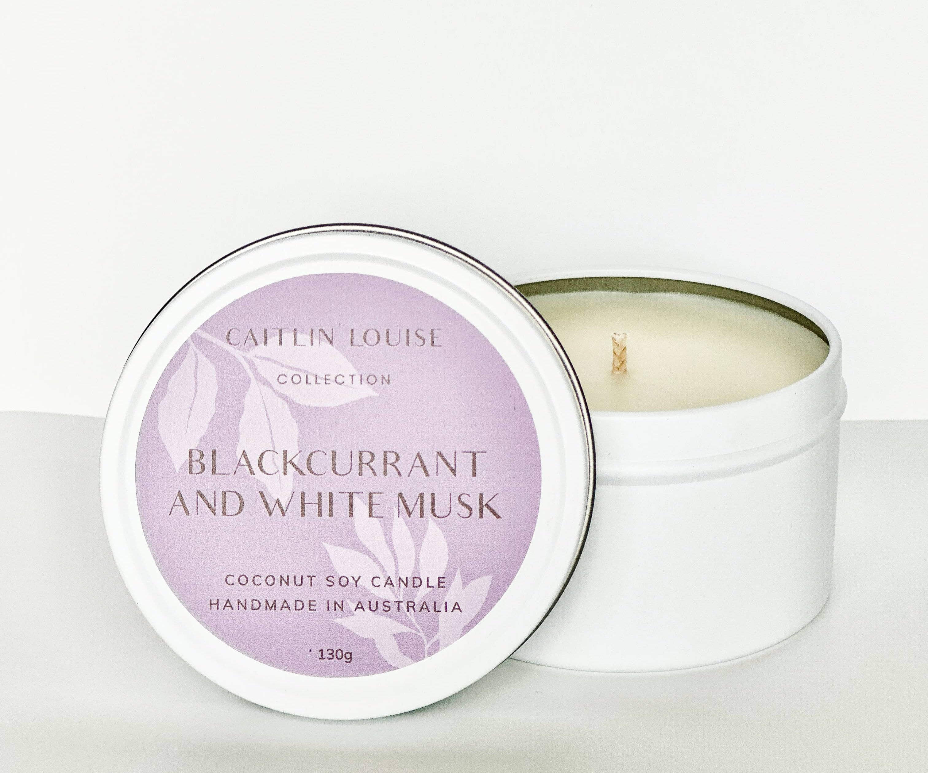 Blackcurrant and white musk travel tin candle - white background