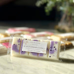 Close up of Caitlin Louise Collection's Black Raspberry and Vanilla Soy Wax Melt Snap Bar on coffee table