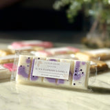 Close up of Caitlin Louise Collection's Black Raspberry and Vanilla Soy Wax Melt Snap Bar on coffee table