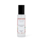Room spray bottle labeled 'Blood Orange & Neroli' by Caitlin Louise on a white background