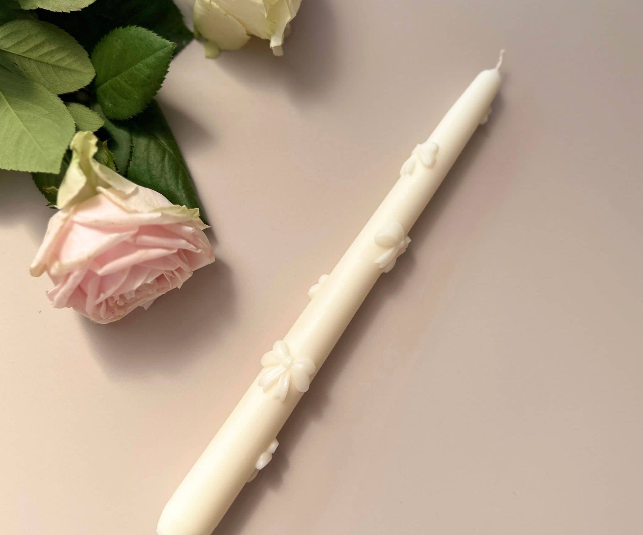 Bow Taper Candle - flat lay