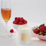 Champagne and strawberries candle styled with champagne, strawberries and raspberries