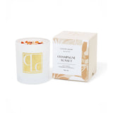 Crystal infused soy Candle with decorative packaging labeled 'Champagne Sunset' on a white background