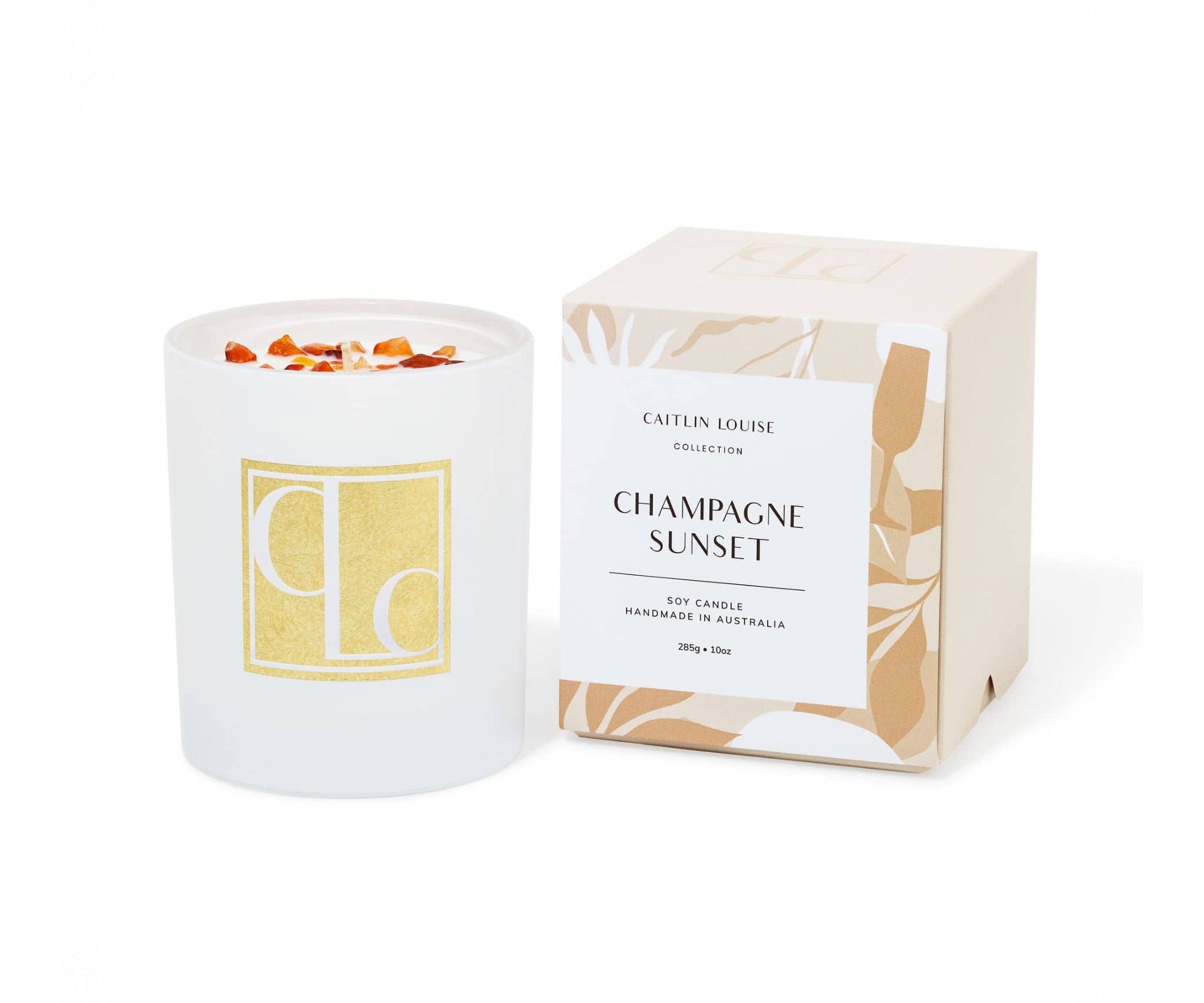 Crystal infused soy Candle with decorative packaging labeled 'Champagne Sunset' on a white background