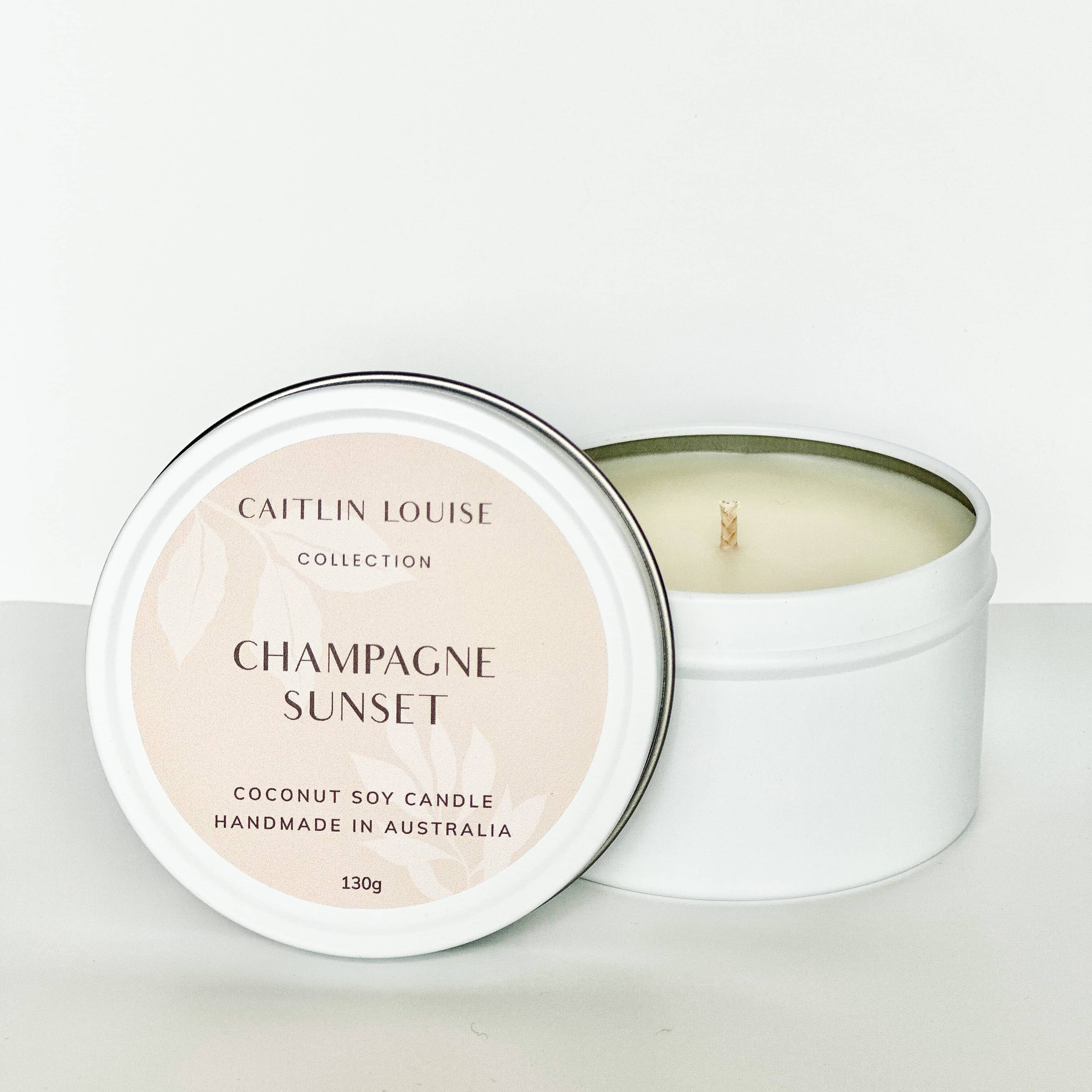 Champagne Sunset travel tin candle - white background