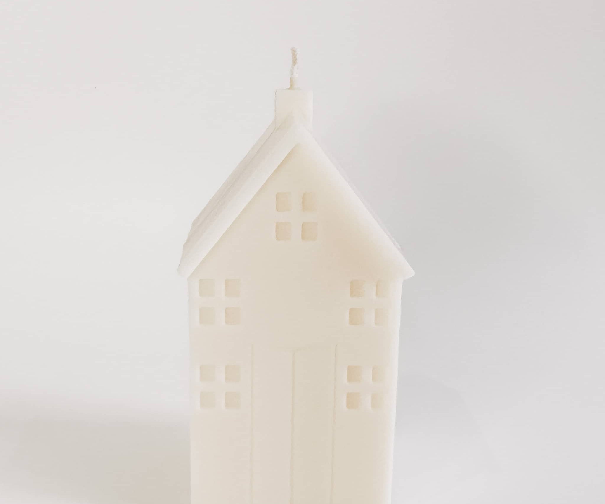 house pillar candle white background