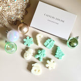 Caitlin Louise Collection Christmas Icon Wax Melts - flat lay with Christmas decorations