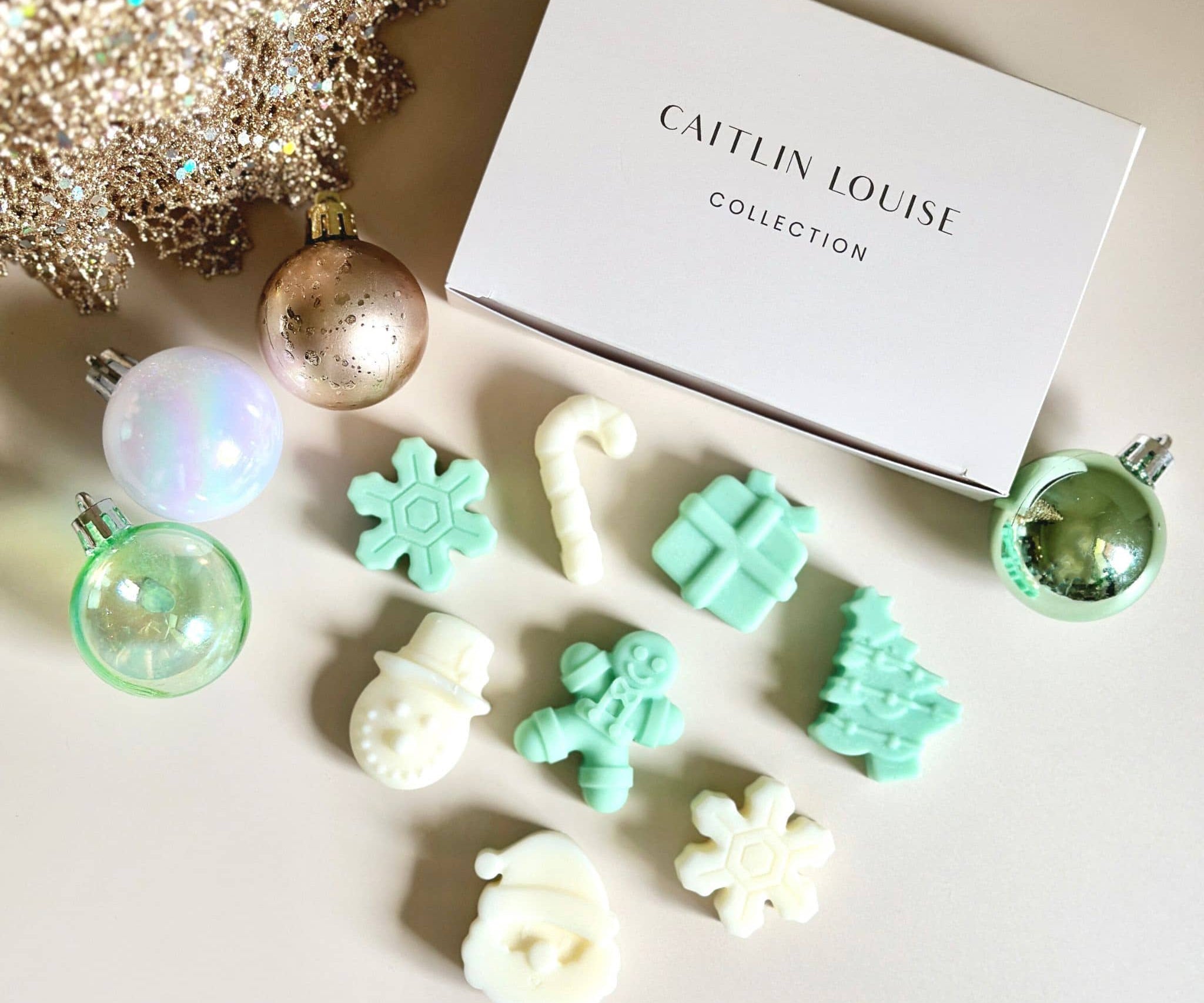 Caitlin Louise Collection Christmas Icon Wax Melts - flat lay with Christmas decorations