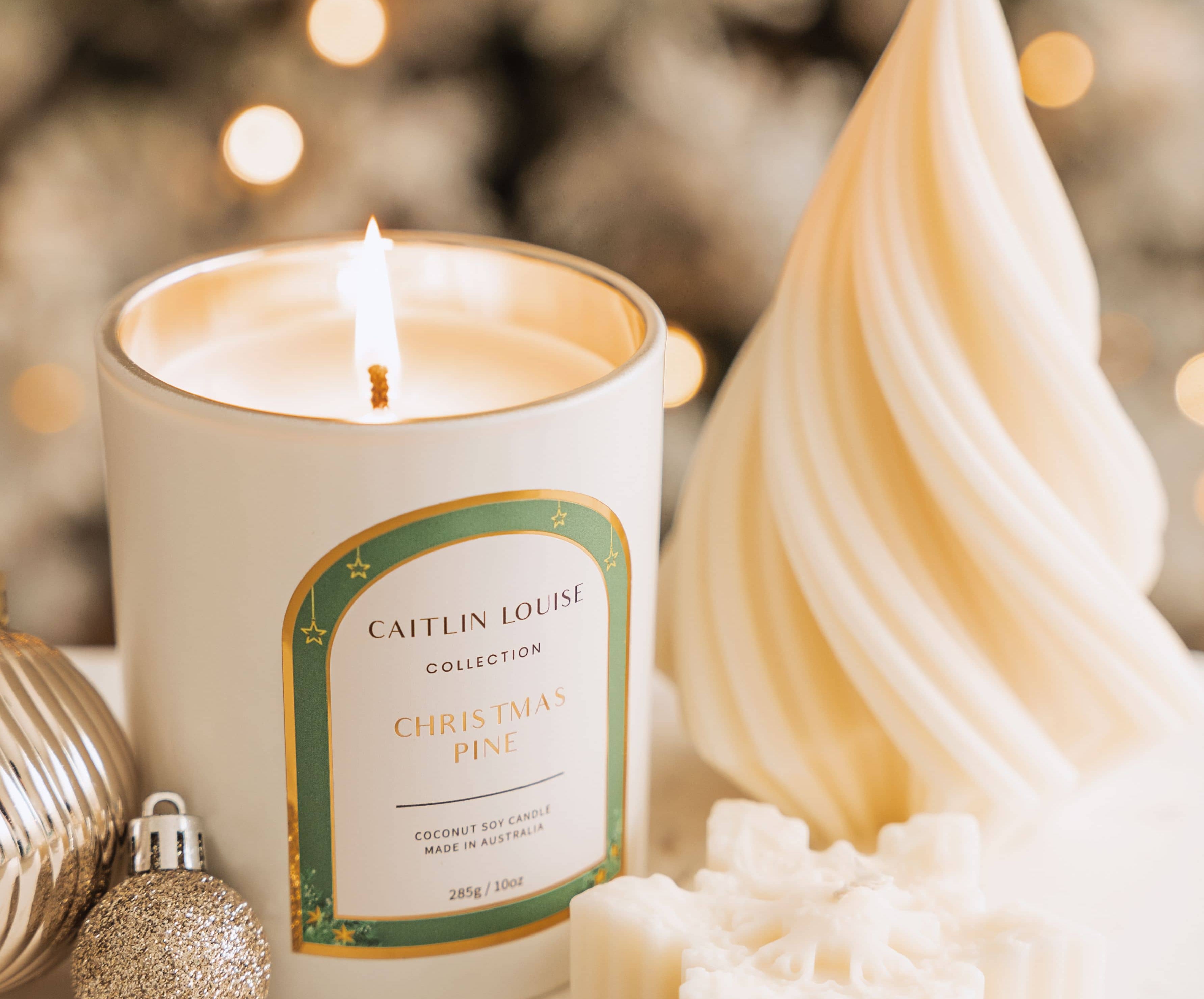 Caitlin Louise Collection Christmas Pine Scented Candle styled with Christmas sculptural candles