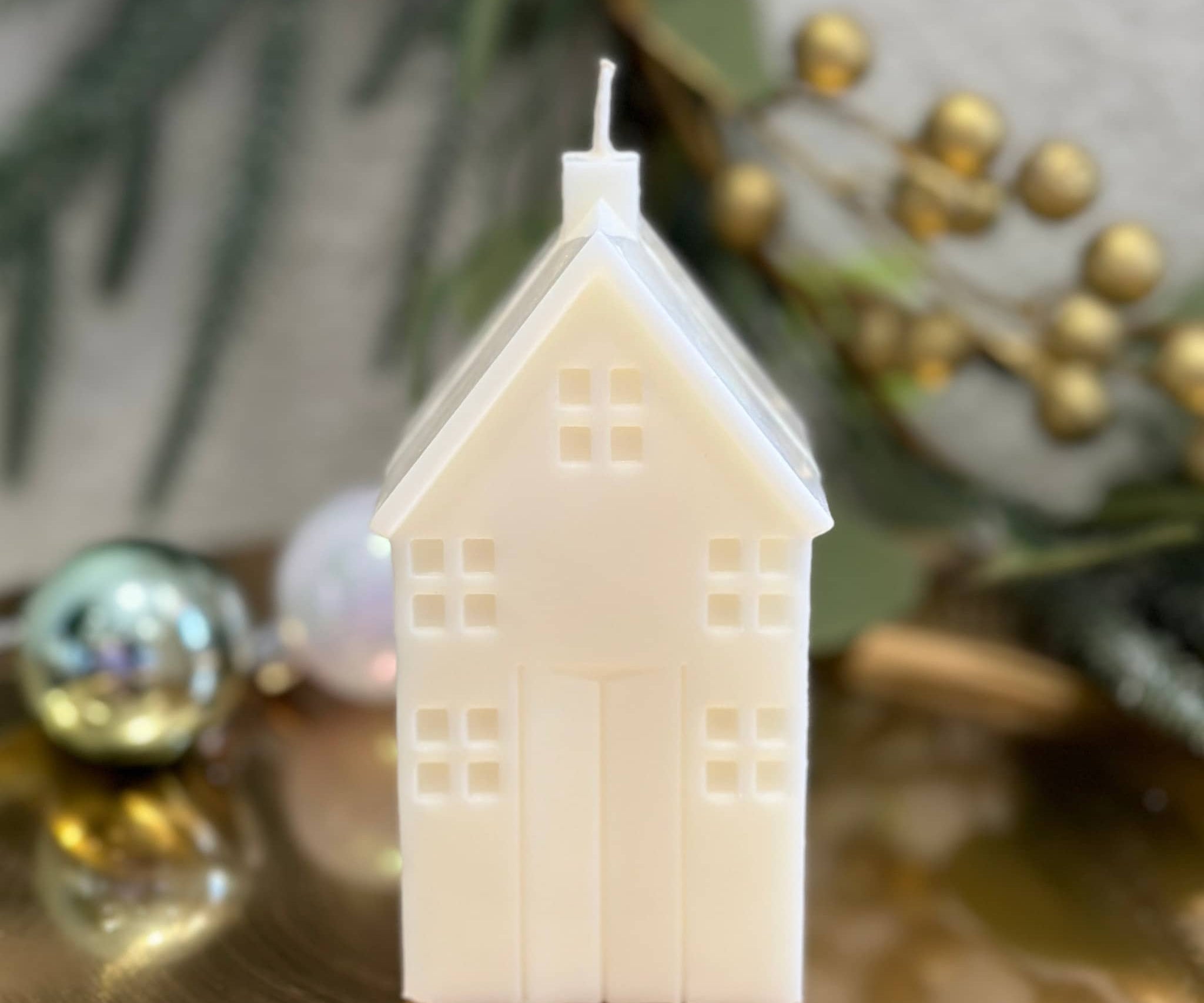 Christmas retreat house sculptural candle on gold tray