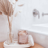 Caitlin Louise Collection Sleep Bath Salts styled on tray next to bath