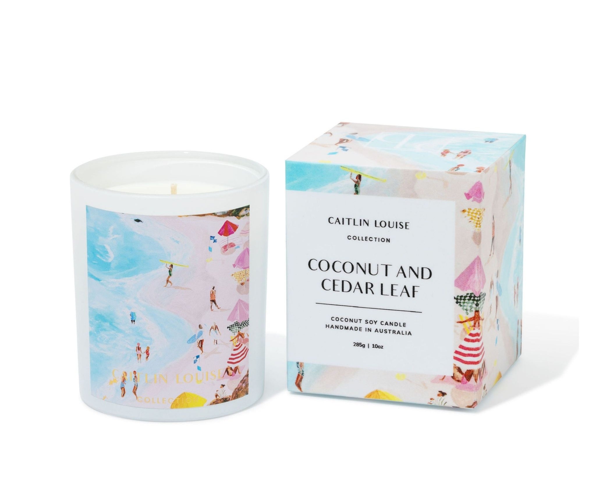 Caitlin Louise Collection Candle with beach-themed artwork and matching box on a white background