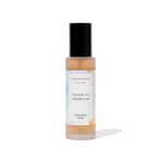 Room spray bottle labeled 'Coconut & Cedar Leaf' by Caitlin Louise Collection on a white background