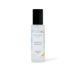 Room spray bottle with coconut and cedar leaf fragrance on a white background