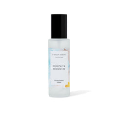 Room spray bottle with coconut and cedar leaf fragrance on a white background