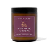 Caitlin Louise Collection candle jar with a purple label featuring text and branding on a white background