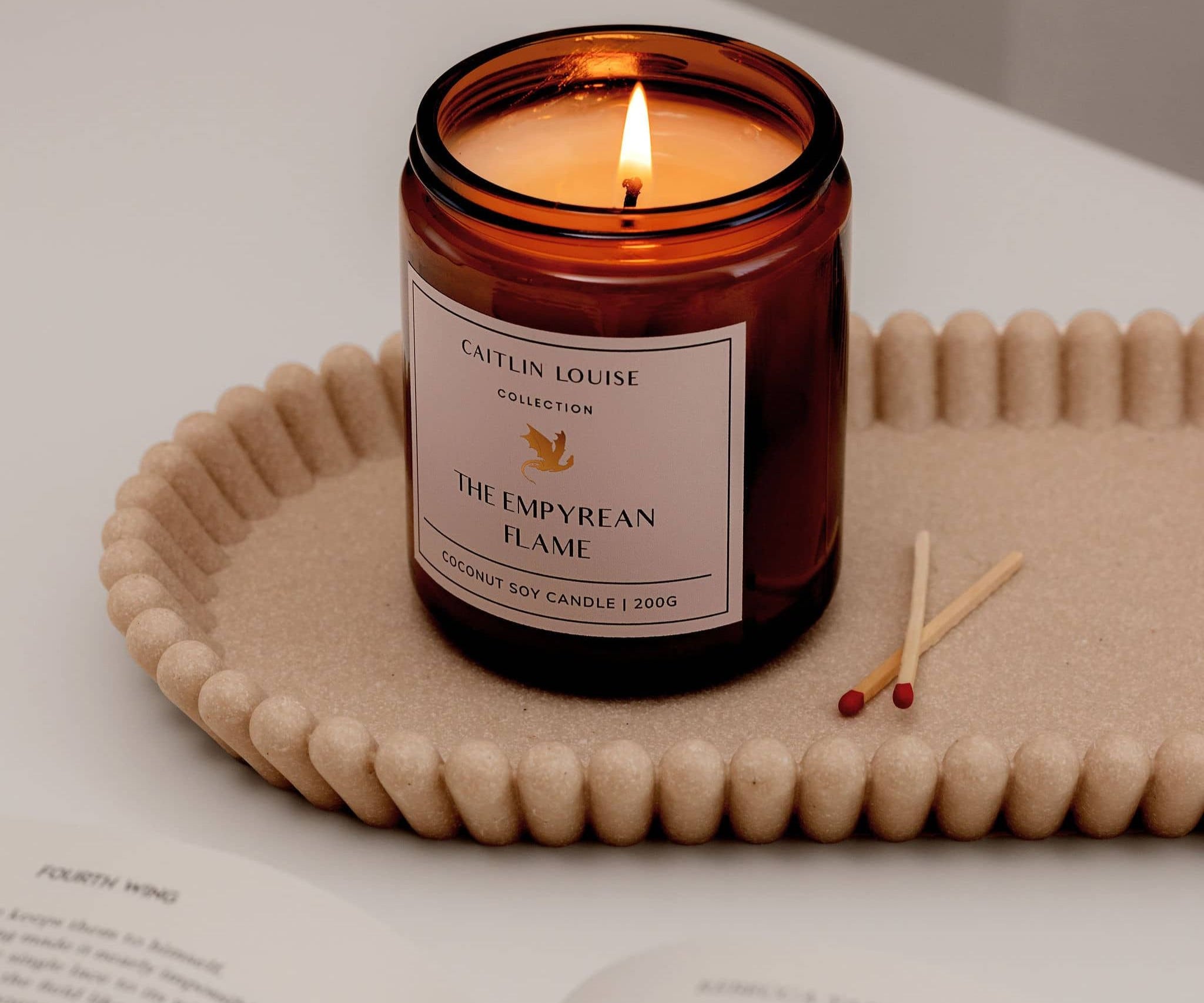 Caitlin Louise Collection The Empyrean Flame Bookish Candle - on tray with book and matches