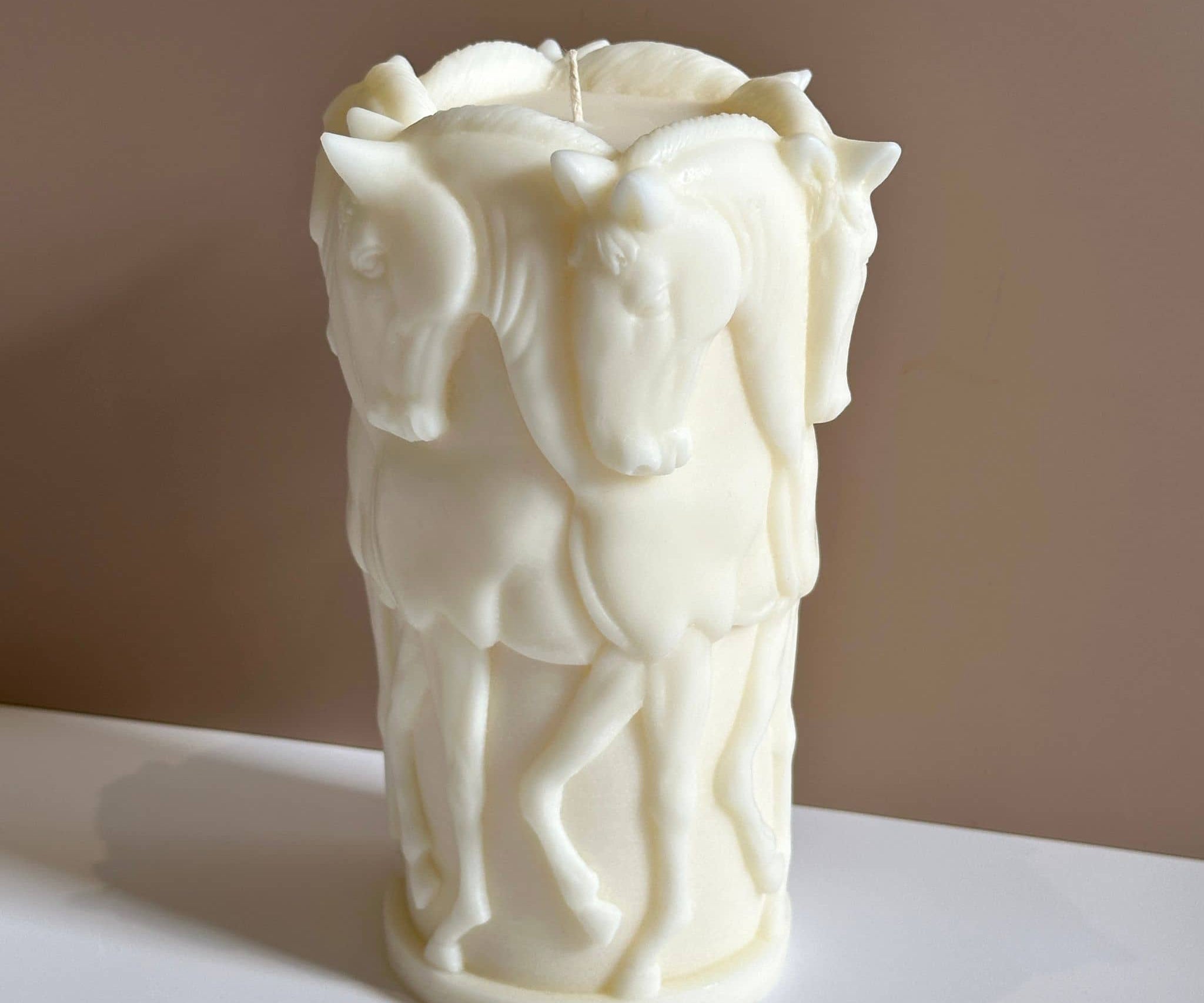 Caitlin Louise Collection's horse sculptural decorative candle - white base - brown background