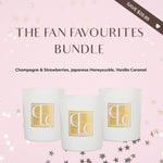 Three candles in white containers with gold logos on a pink background, featuring 'The Fan Favourites Bundle' text.