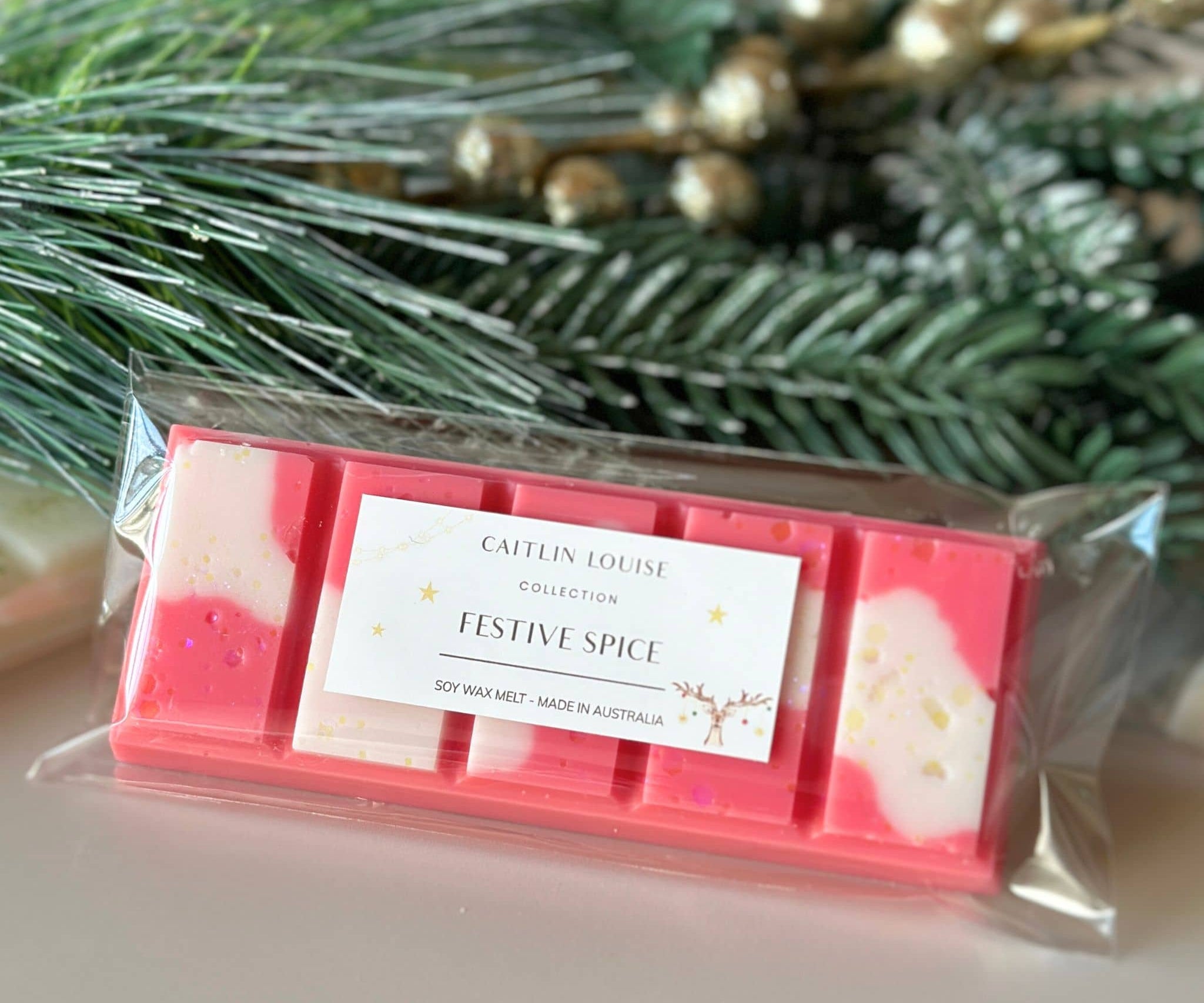 Caitlin Louise Collection Festive Spice Soy Wax Melt in packaging - styled with wreath