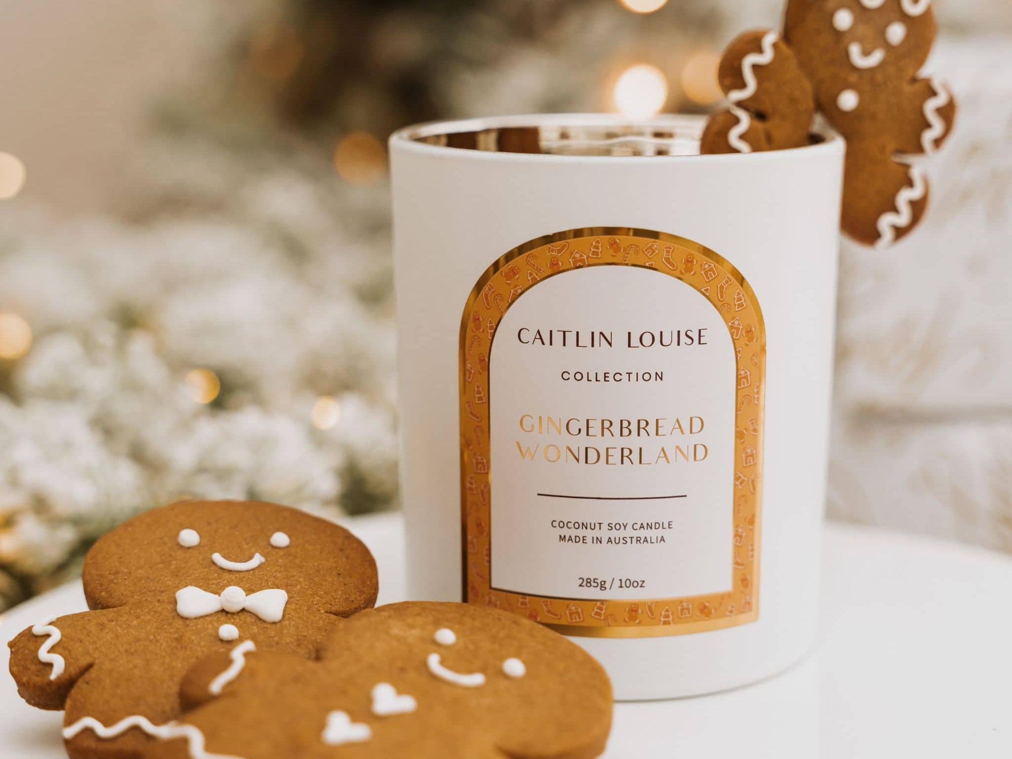 Caitlin Louise Collection Christmas Candle Gingerbread Wonderland styled with gingerbread cookies